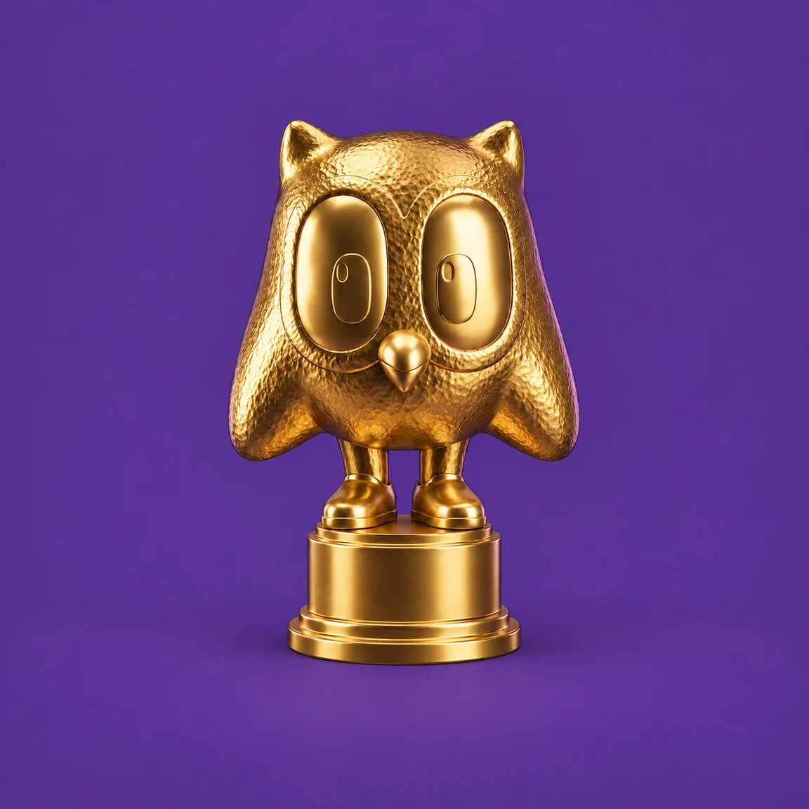 Het Gouden Uiltje: een gouden uil op een ronde sokkel, tegen een paars vlak